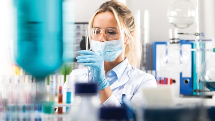 Female scientist conducting experiment