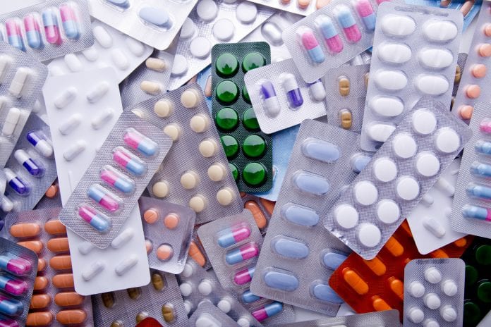 Colorful Assortment Of Medicine Tables and Capsules.