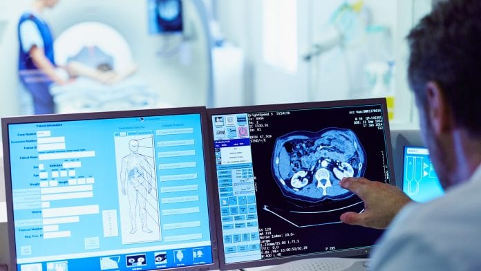 H12 M Gould REP 2003 atl image doctor looking at computer