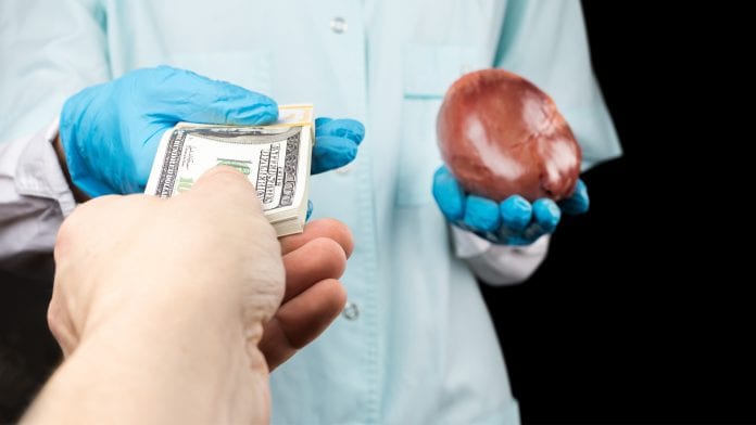 man paying for an organ