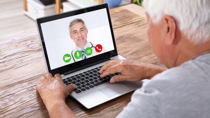 iStock-AndreyPopov old man on video chat to doctor