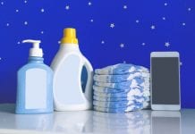 Bottles of cleansers, diapers and a phone in the nursery