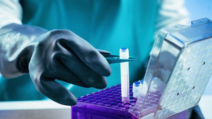 biobanking scientist putting a container for storage