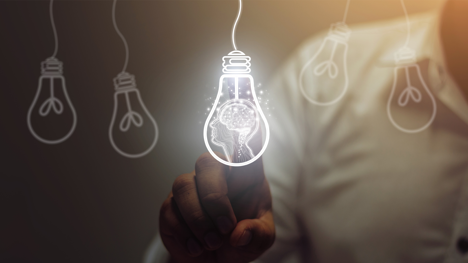 Businessman touching light bulbs. ideas of new ideas with innovative technology and creativity