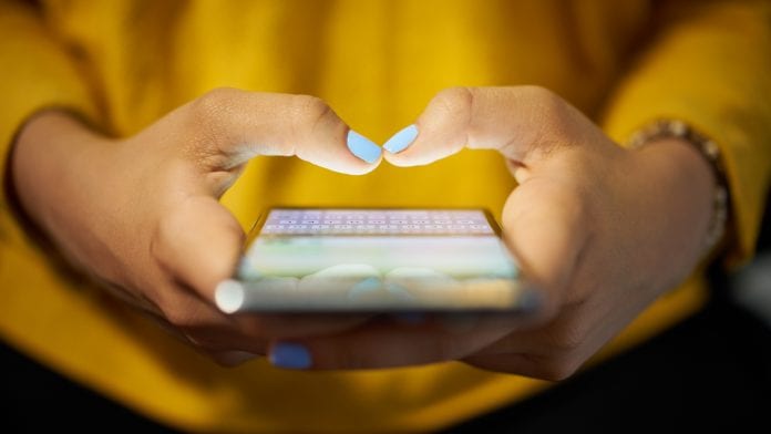 girl texting on her mobile phone