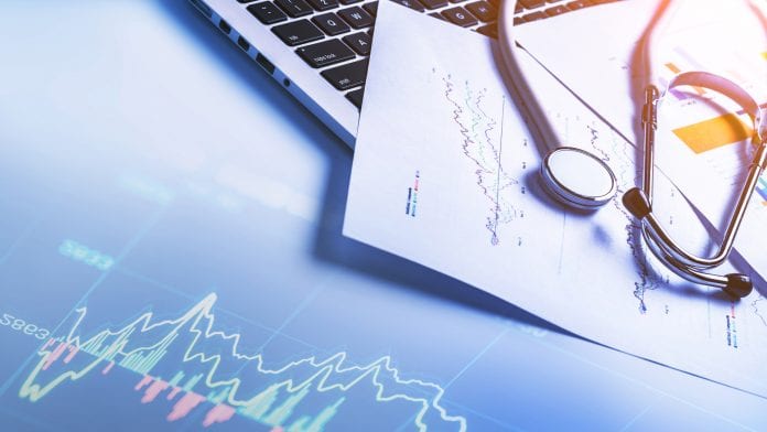 Stethoscope on computer keyboard stock photo