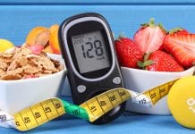 New collaborative partnership focuses on type 2 diabetes prevention Glucometer with result of measurement sugar level, healthy food, dumbbells for fitness and tape measure, concept of diabetes, slimming, healthy lifestyle
