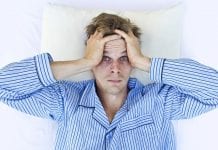 A man not able to get to sleep because of sleep disorder