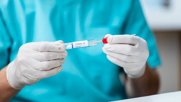 ©iStock/zoranm Testing for COVID-19 with saliva