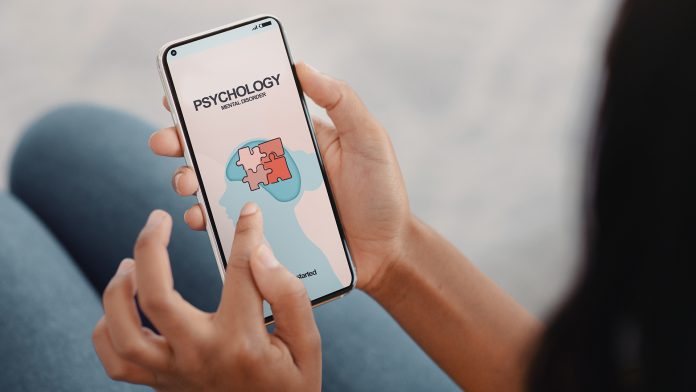 Unrecognizable young woman contacting mental health centre, needing psychological help, using online smartphone app depression