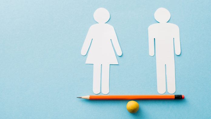 small ball and pencil with paper cut of couple isolated on blue, sexual equality concept gender inequality