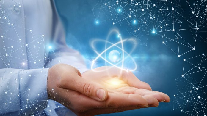 Atom molecule in female hands. Defence Therapeutics: Accelerating the fight against cancer and infectious diseases