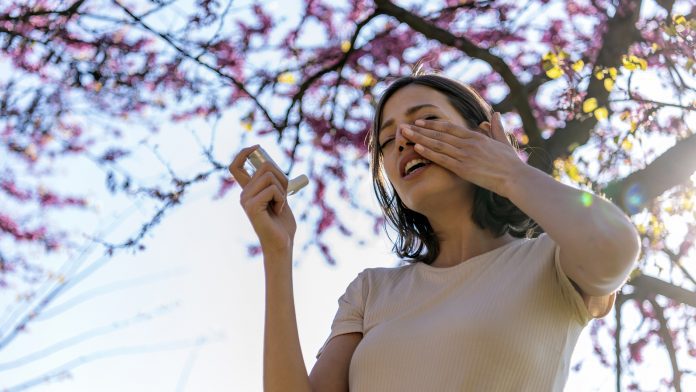 Woman Using Asthma Inhaler Outdoor allergic asthma