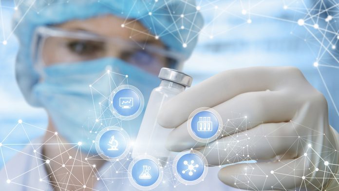 A doctor is looking at the capsul with some medicine inside in her hand surrounded by icons with madical symbols. drug-delivery system